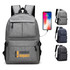 A grey laptop backpack with multiple compartments and a logo, featuring a charging port and adjustable straps.
