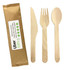 A wooden cutlery set featuring a knife, fork, and spoon, presented with a brown paper wrapper.