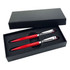 A set of two red pens with silver accents in a black gift box.