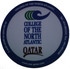 A round, white PVC coaster featuring a logo and text related to the College of the North Atlantic, Qatar.