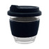 A reusable glass coffee cup with a black silicone sleeve and lid, featuring a transparent body.