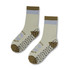 A pair of Nero Crew Grip Socks in light green, brown, and blue, featuring a pattern on the soles and a logo.