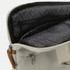 A beige laptop bag with a lined interior and zippered compartments. It features a light grey pattern inside.