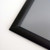 Close-up of black metal snap frame with 0.59-inch profile and mitered corner for retail signs, posters and wall displays, Item# CSF1-3040