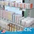 Retail shelf label holders installed beneath boxed personal care products and bottles.