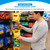 White clip strip holding bagged chips on a grocery shelf while a shopper reaches for a snack.