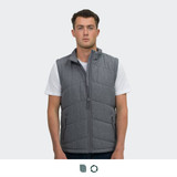 A grey puffer vest with a zip front and side pockets, worn by a model standing straight.