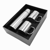 A drink bottle and two matching mugs in a sleek black gift box, featuring a shiny silver finish.