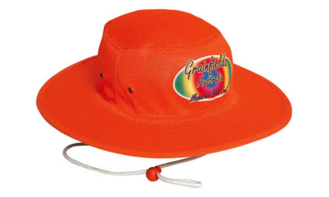 A luminescent safety hat in bright orange, featuring a logo on the front and a chin strap for secure fit.