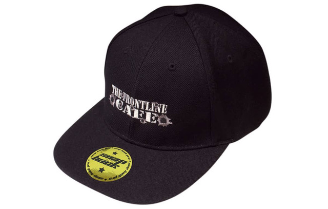A black snapback cap with a logo on the front and a branded sticker on the peak.