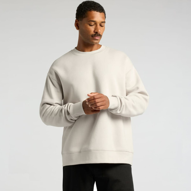 A light grey jumper sweater with a relaxed fit, featuring long sleeves and a crew neck. It has a subtle logo.