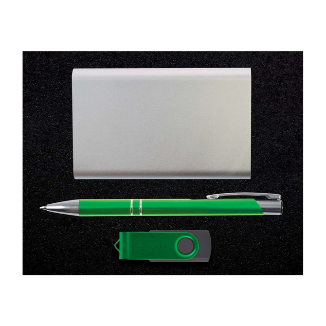 A silver card holder, a green pen, and a green USB flash drive are arranged on a black surface.