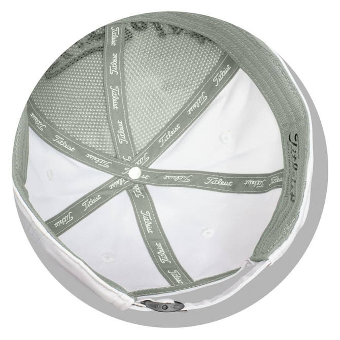 A white cap with a green underside features a mesh lining and has a logo inside.