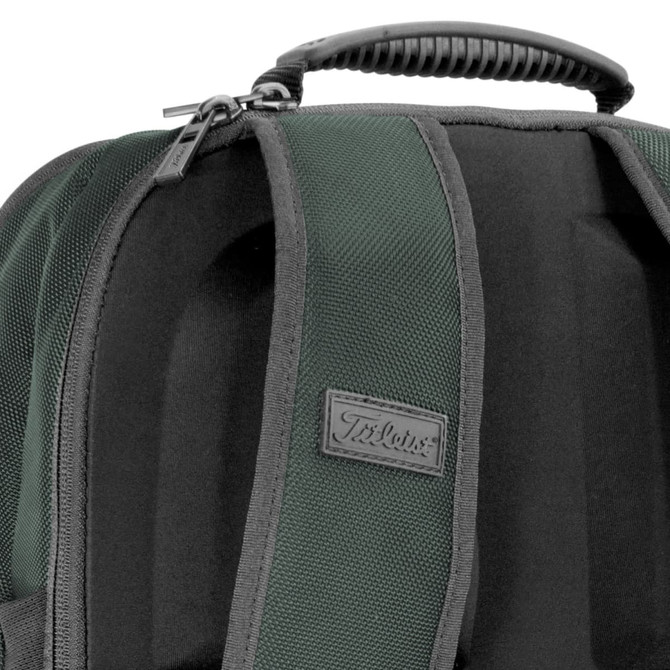 A dark green backpack featuring a textured surface and a carry handle, with a logo present on the front.