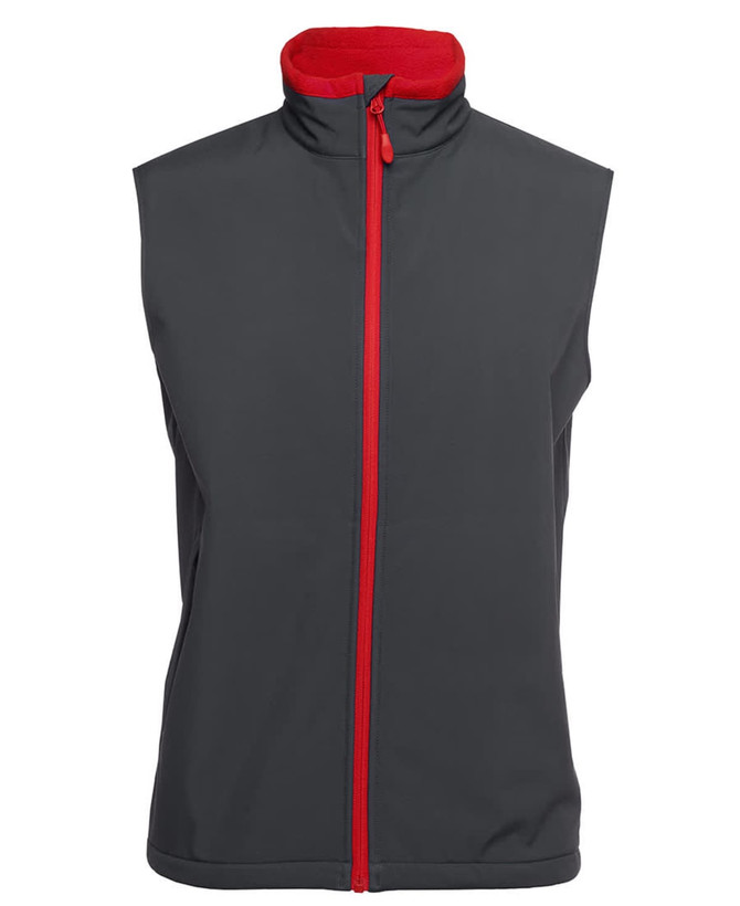 A three-layer softshell vest in dark grey with a red collar and zipper, featuring a logo.