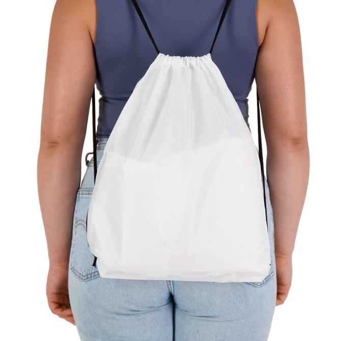 A white drawstring backpack with black straps, shown from the back on a person wearing a fitted top and jeans.