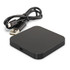 A square black wireless charger with a USB cable, featuring a sleek and minimalistic design.