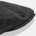 A flat cap featuring a herringbone pattern in shades of grey, with a rounded top and a small brim.