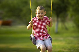 New Mexico_boy_swinging_offered_candy_taken