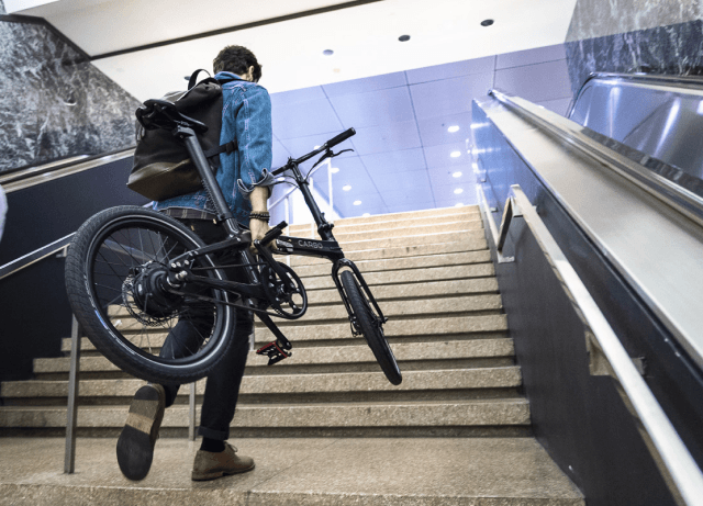 Man Carring Lightweight eBike on Stairs