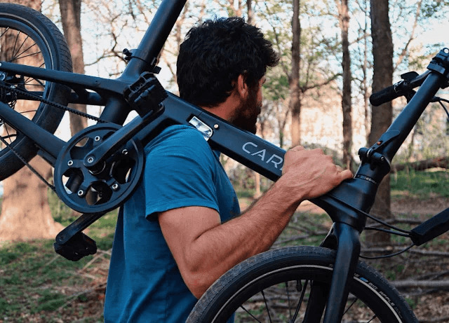 Man shouldering Lightweight Carbo Ebike