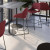 Jola Bar Height Fabric Stool with Black Metal Base in Crimson Fabric - shown with counter-height tables