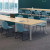 Willow Mid Back Guest Chair with Black Sled Base - Blue fabric shown in group with maple tables