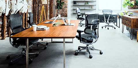 Eurotech ErgoHuman GEN2 executive chair in office with brick wall