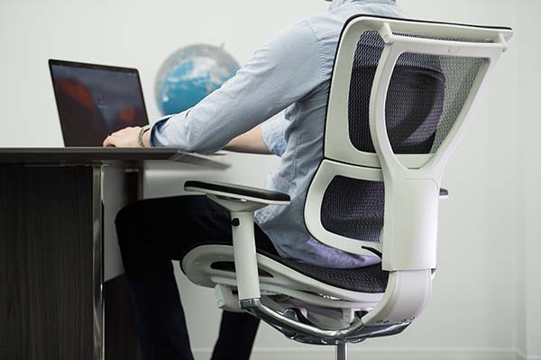 Man sitting in iOO White Frame Ergonomic Executive Mesh Office Chair