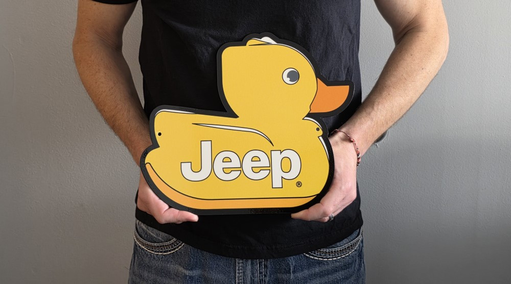 Jeep Yellow Duck Emblem Metal Sign (holding in hand)