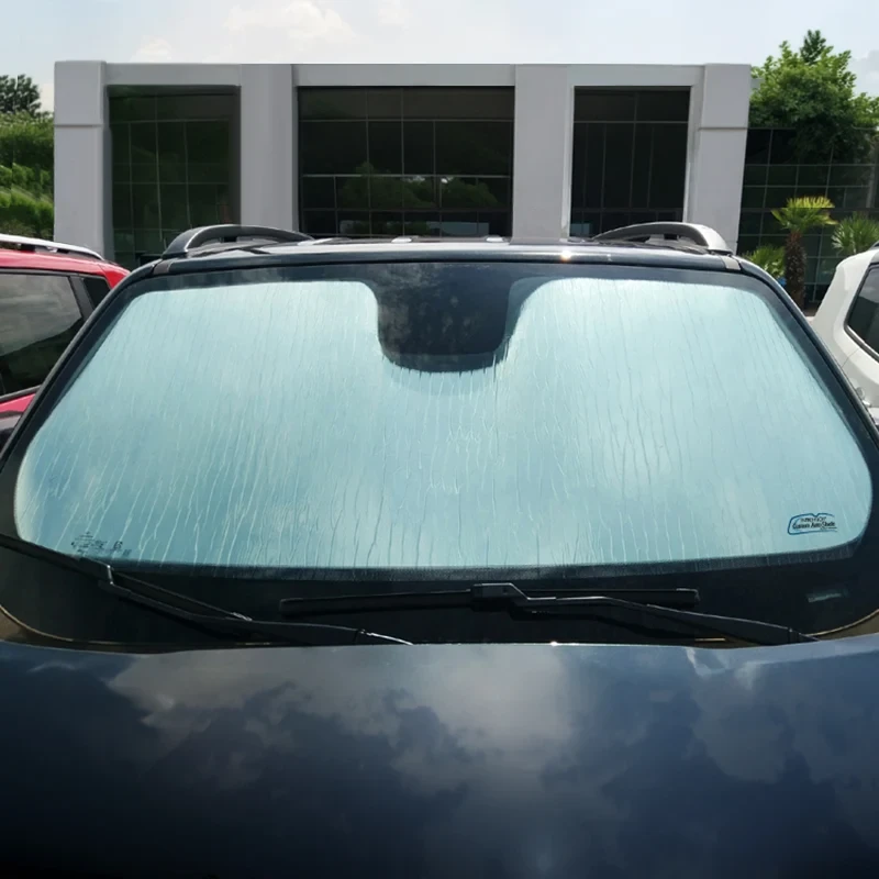 Custom Fit Roll Up Windshield Sun Shade - on blue car