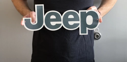 Jeep Green Script Metal Sign (holding in hands)