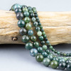 mossy greens, browns, and blue tones in round beads
