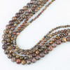 warm brown, tan, cream, rust, gray, and reddish tones