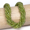 Cherry Tree Beads Peridot 4mm Faceted Round Beads on a 15-inch strand featuring natural green gemstone beads with a sparkling faceted finish for jewelry making.