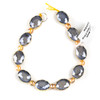 Crystal 12x16mm Opaque Grey Faceted Oval Beads with Golden Foil Edges - 8 inch strand