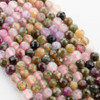 pink, green, cream, and brown round beads