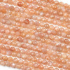 Peach Moonstone 5mm faceted round beads in a 15-inch strand, showcasing the delicate shimmer and warm tones of natural gemstone beads.