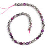Fuchsia Agate 8mm natural gemstone beads with faceted round shapes and silver plating, strung on a 15-inch strand with vibrant pink threading.