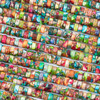 Close-up of Dyed Fiesta Rainbow Impression Jasper 3x6mm Heishi Beads - color #06 showing the vibrant mix of bright and earthy colors, marbled patterns, and smooth heishi bead shape.