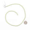 Glow-in-the-Dark Glass Round Beads - 4mm, Yellow Green, 15 inch strand, displayed alongside a dime for size reference, ideal for jewelry making and crafts with stunning beads that glow in the dark.