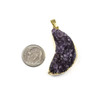Druzy Amethyst approx. 21x34mm left-facing moon pendant with gold foil edges and bail, a unique natural gemstone pendant displayed next to a dime for size reference.