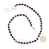A 15-inch strand of natural gemstone beads featuring 6-6.5mm amethyst bicone beads, beautifully accented with gold spacer beads.