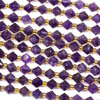 A strand of natural gemstone beads featuring 6-6.5mm amethyst bicone beads, elegantly accented with gold spacers on a 15-inch strand.