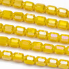 Crystal 6x7mm Opaque Daffodil Yellow Faceted Tube Beads with an AB finish - 8 inch strand