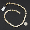 Cherry Tree Beads Mother of Pearl 6x9mm Tan Carved Leaf Beads - 16 inch strand 