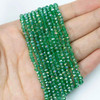 Crystal Beads - 2.5x3mm Faceted Rondelles, Emerald Green with an AB finish, 14 inch strand
