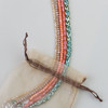 a warm, earthy mix of crystal bead strands in coral rose, orange sherbet, champagne, seaweed green, and soft milk chocolate tones