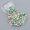 seafoam green, soft coral, warm champagne, creamy peach, and sandy taupe crystal beads inspired by windswept beaches and gentle ocean tides
