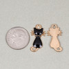 Enameled gold pewter 22x12mm cat charm shown next to a coin for size reference